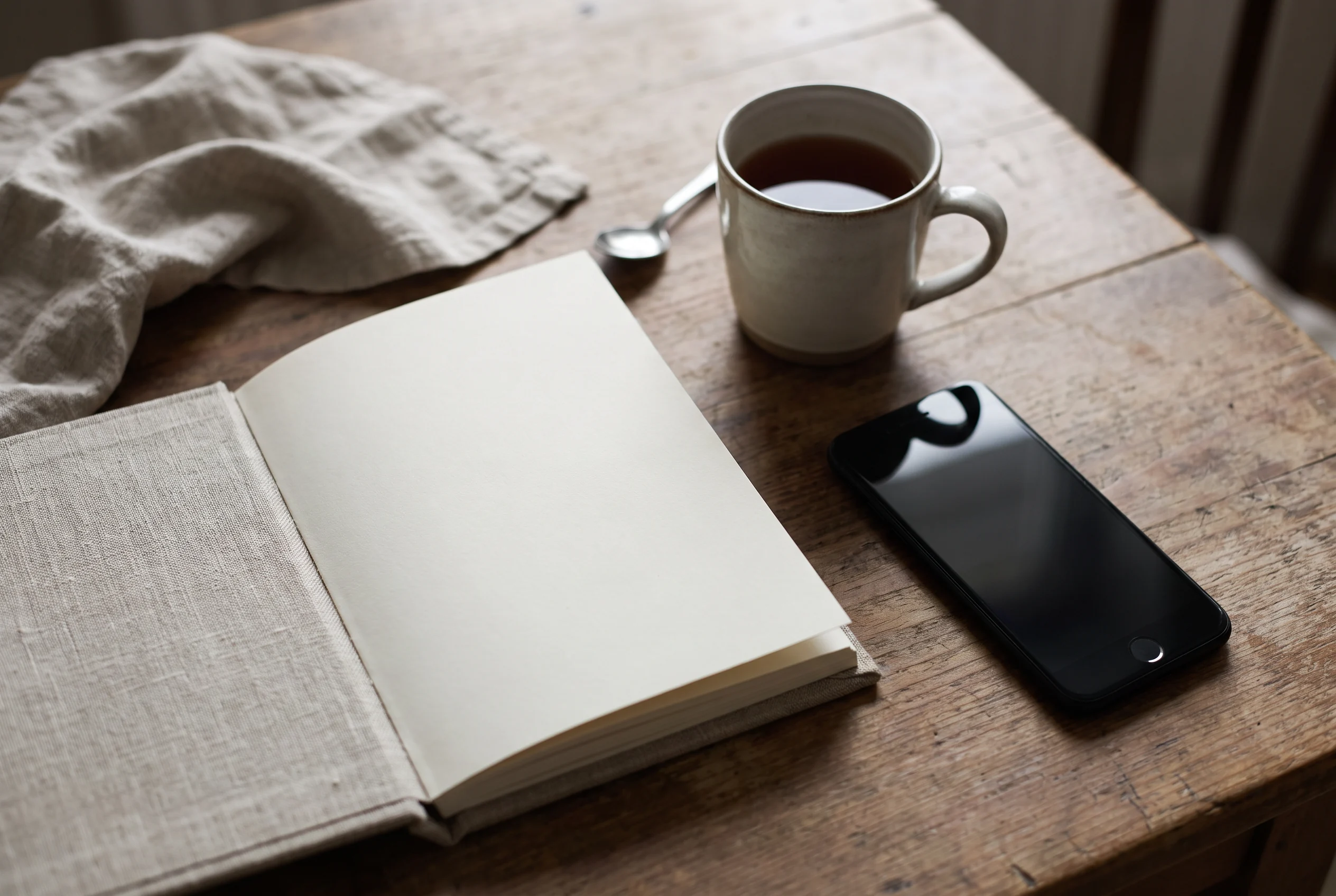 Notebook and phone on a calm desk